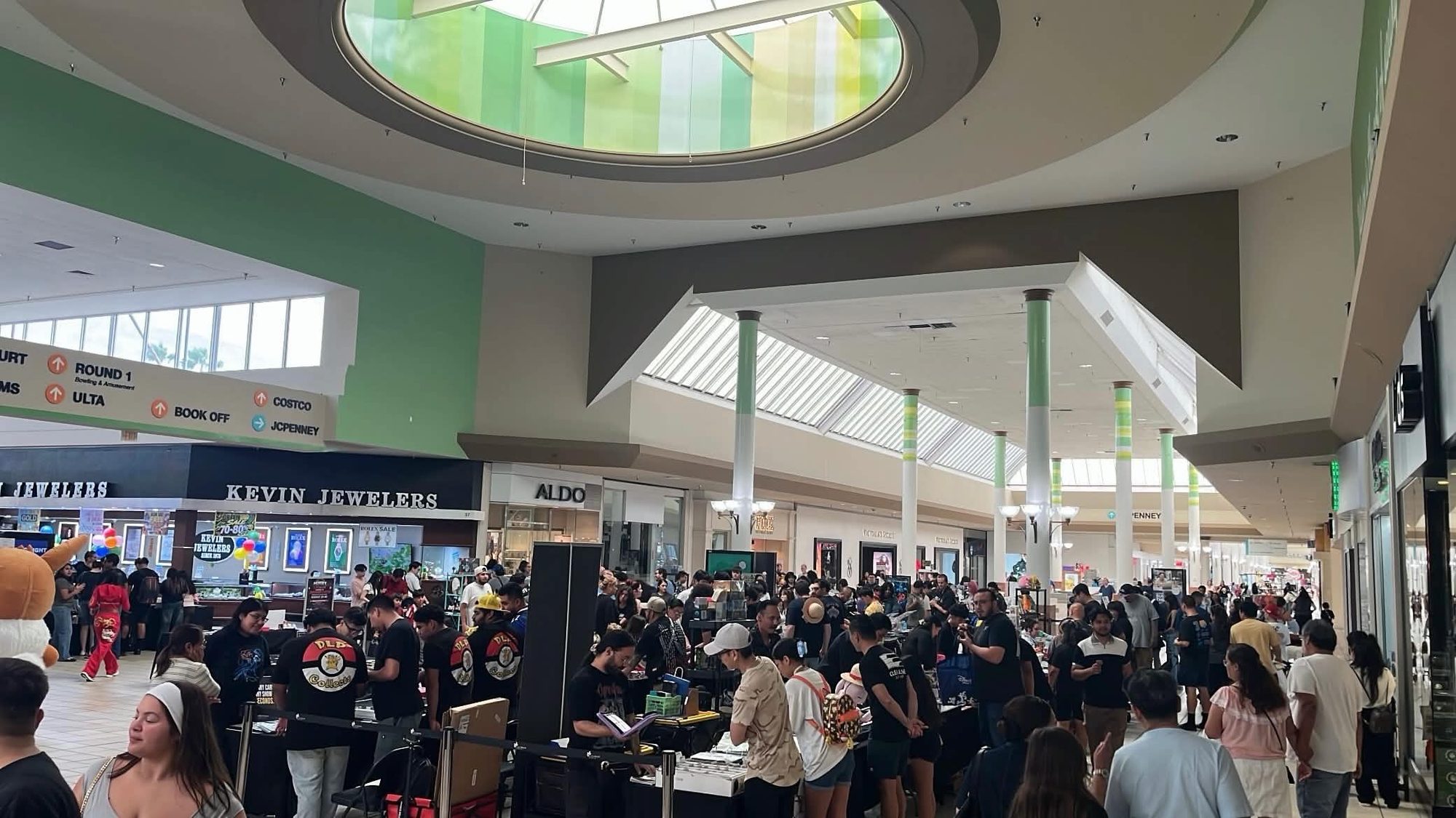 Packed crowd on the expo floor under the Lakewood Center skylight