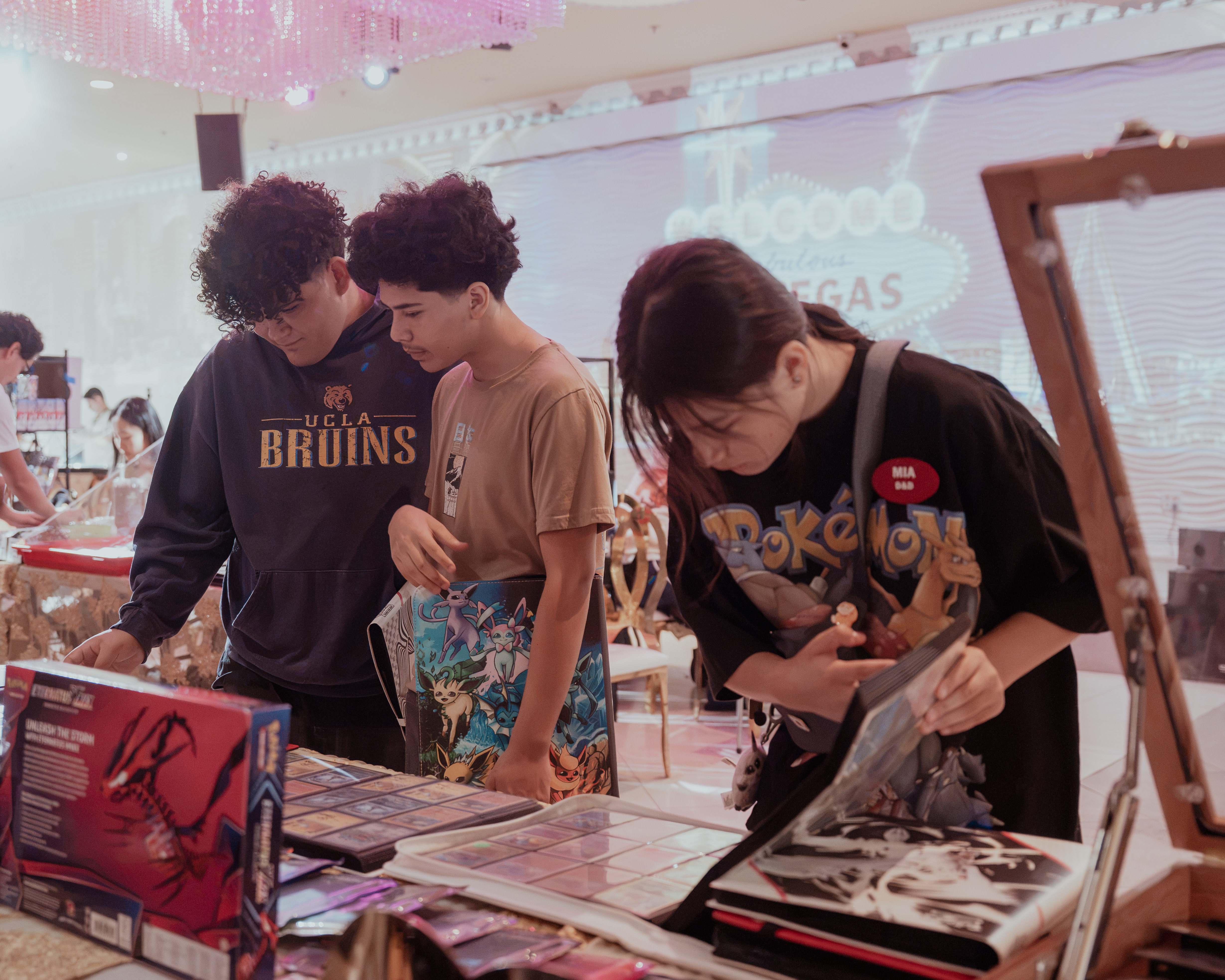 Collectors browsing cards at vendor table